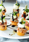 Skewer Prosciutto Mozzarella fresh basil & Marinade melon