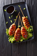 Teriyaki-style chicken skewer with toasted black sesame sauce